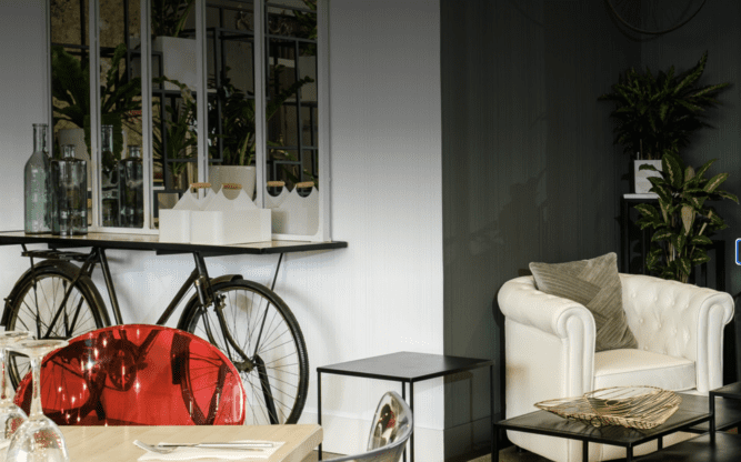 Foyer of Hotel Clement in Madrid, Spain. Stylish living room with a bike.